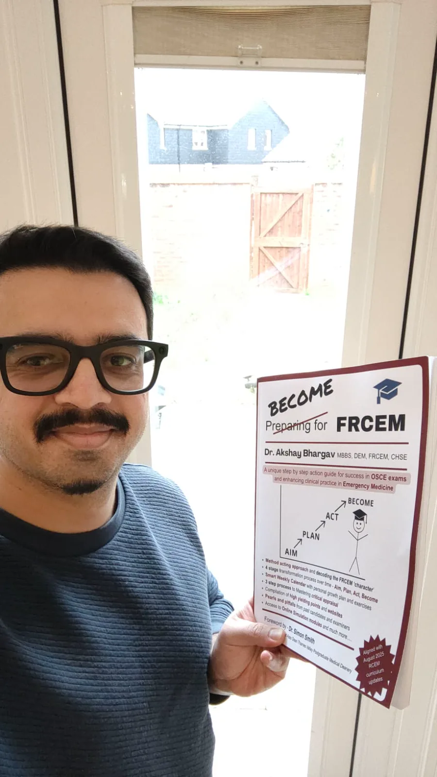Shub holding the copy he bought of Become FRCEM by Dr Akshay Bhargav